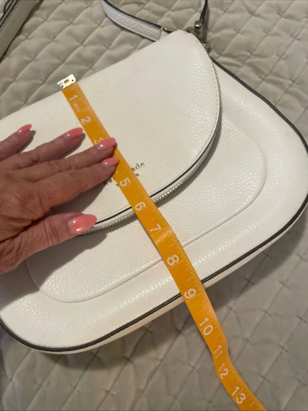 kate spade cream pebbled leather crossbody with gold logo